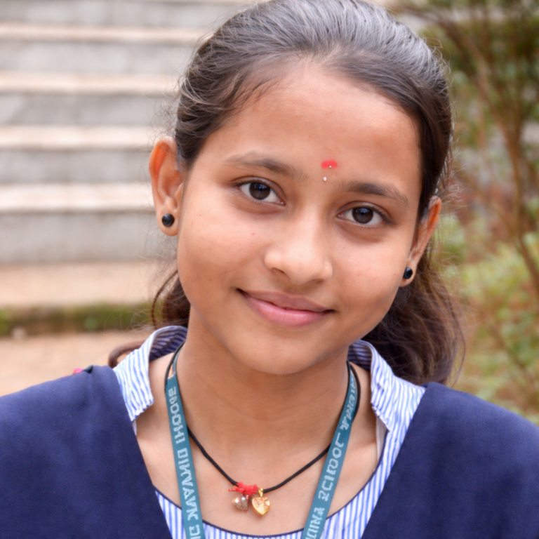 Young woman in school uniform outdoors